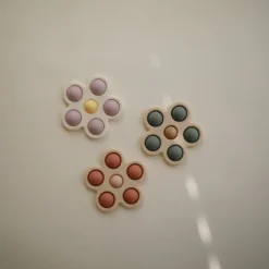 Idealne W Podróży|12M+ | Mushie Kwiatek Press Toy - lilac, pale daffodil, ivory