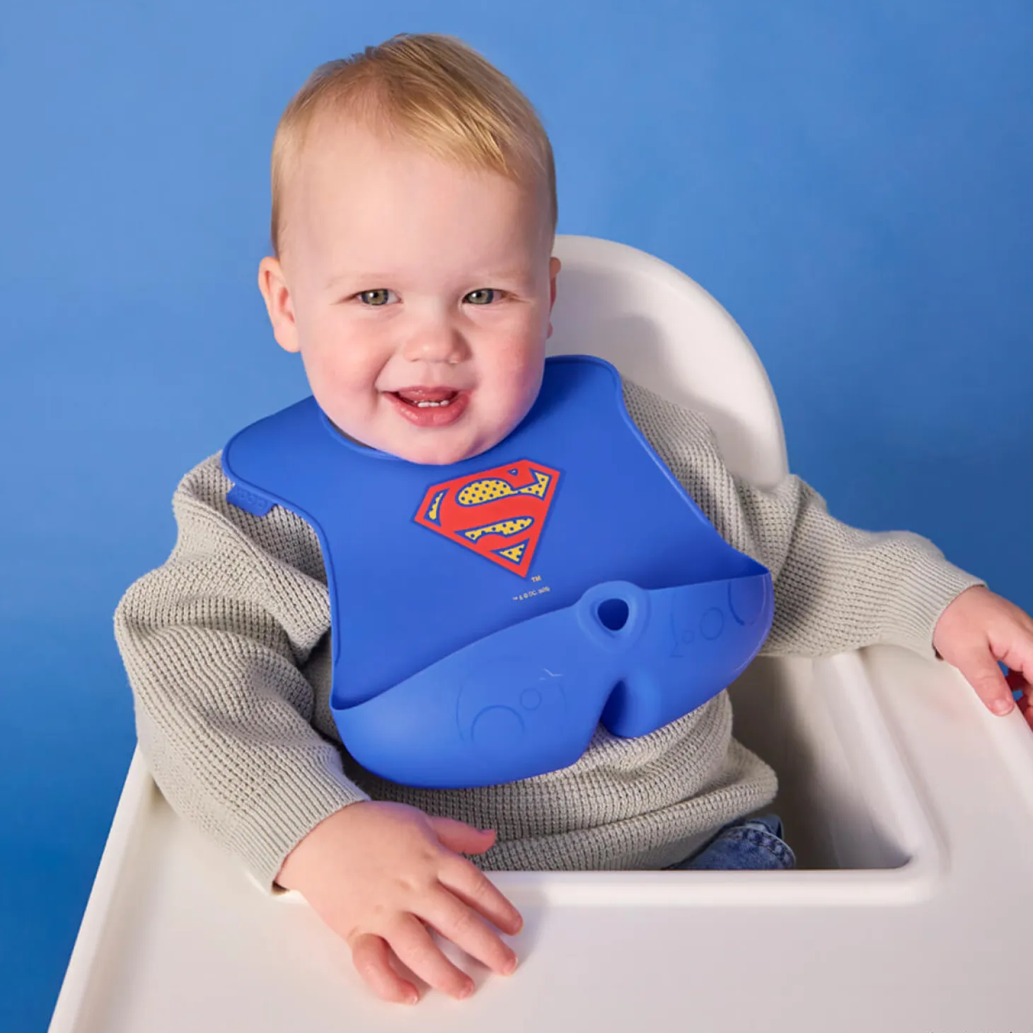 Śliniak z otwartą kieszonką Superman